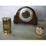 Three vintage time pieces to include a cylindrical Swiza alarm time piece, two train oak mantle