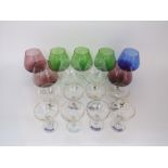 A harlequin collection of various coloured and clear glass brandy goblet style vases (9) together