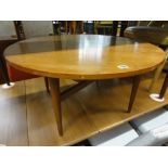 A good quality Gordon Russell of Broadway teak coffee table, the circular top upon four tapered legs