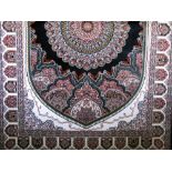 A contemporary Persian silk floor rug centrally decorated with a Shabas floral medalion design