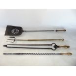 A set of four fire irons to include a telescopic toasting fork