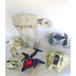 A collection of original Star Wars toys to include ATAT Walker, X-wing, Tie fighter, etc