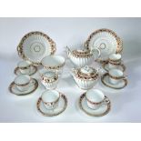 A collection of Victorian tea wares of fluted form with painted and gilded leaf decoration