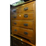 An Edwardian oak chest of three long and two short drawers within a reeded framework, 94 cm wide