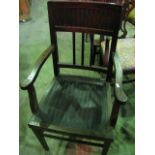An open elbow chair, with stained wooden frame, with panelled seat and back