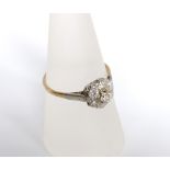 An 18ct gold and diamond cluster ring, total estimated diamond weight 0.75 cts, ring size 'Q'