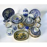 A collection of blue and white printed ceramics including reproduction ironstone caddy and cover,