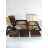 A collection of reproduction and replica antique gaming sets, together with faux leather boxes and