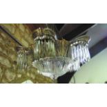 Art deco period ceiling light with a cast metallic frame supporting six bowls with further cut glass