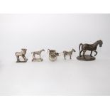 A collection of Indian white metal novelty items to include a horsedrawn cart, a bull and two