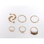 Three 9ct gold rings, one paste set together with two sets of unmarked yellow metal hoop earrings,