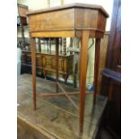 A Regency mahogany ladies sewing table of rectangular form with canted corners raised on square