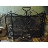 A iron fire basket 80cm wide, two good quality hand wrought fire irons, two iron fire screens and