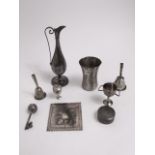 A collection of Indian white metal items to include two bells with integrated whistles, a small
