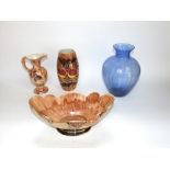 A collection of Oldcourt wares with painted and lustred fruit and foliage decoration on a brown