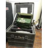 A military steel flight cased trunk fitted with various aviation books and military equipment