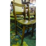 A set of four elm seated chapel chairs with bible wells to the back (4)