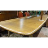 A good, rare Ercol light elm extending dining table, the planked top upon five splayed legs, 72 cm