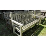 A Barlow Tyrie three seater teak wood garden bench