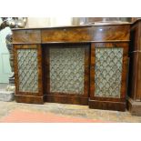 A Georgian mahogany inverted break front sideboard fitted with three frieze drawers, the doors