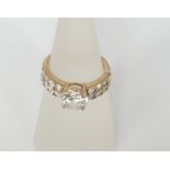 A 14ct gold ring set with large central cubic zirconia and cubic zirconia set shoulders 4.0 g