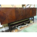 A Danish style long tall sideboard fitted with four square veneered doors enclosing a shelved