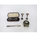 A pair of silver flare rimmed trumpet vases, London 1899, a cased set of silver cutlery, a silver