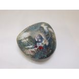 An Australian Studio Glass paperweight by Chris Pantano in the form of a rock with stylised native