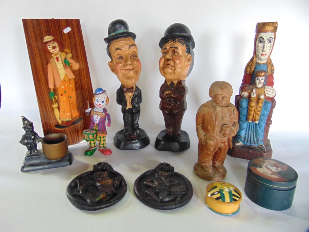 A mixed lot of clown related items to include tin plate winding toy, various lead and metal figures,