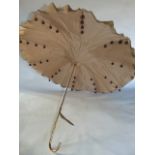 Interesting antique parasol, the hood with various tassel decoration upon a relief gilt metal handle