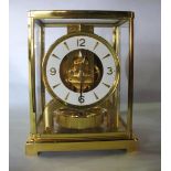 A Jaeger-LeCoutre gilt brass Atmos clock serial no. 443904, 23cm high