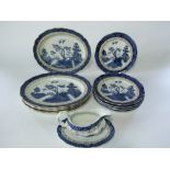 A collection of Booths Real Old Willow pattern blue and white printed dinner wares comprising a