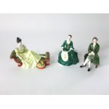 A Royal Doulton figure - At Ease HN2473, together with a pair of Royal Doulton figures, A Lady