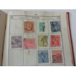 A Lincoln Stamp Album containing a collection of British and worldwide stamps together with The