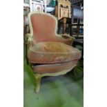 A French scrolled framed bedroom chair with pink upholstery and painted white frame