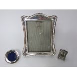 Three silver easel picture frames