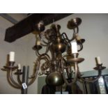 A Dutch style anodised brass hanging ceiling light/electrolier with six scrolling branches