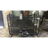 An iron fire basket 80 cm wide, two good quality hand wrought fire irons, two iron fire screens