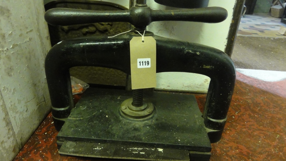 A vintage cast iron book press