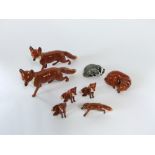 A collection of Beswick models of foxes including a pair of large standing examples (1 boxed), a