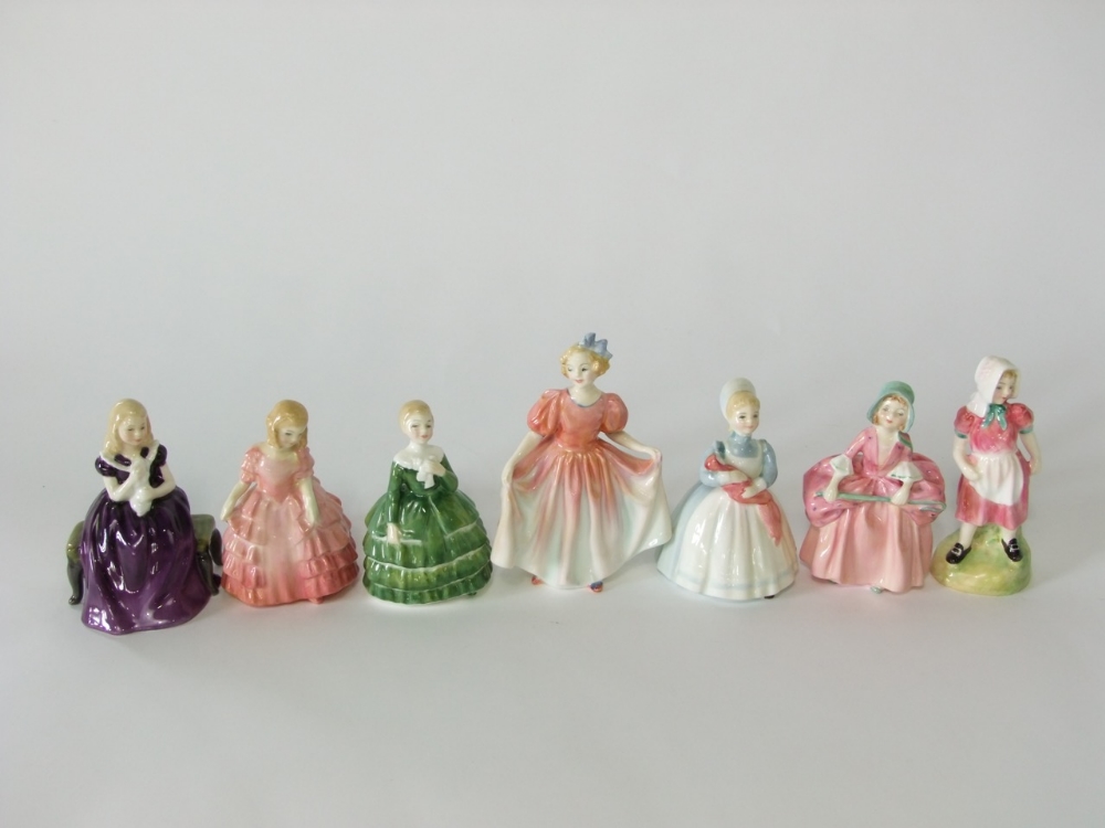 A collection of seven Royal Doulton figures comprising Rose HN1368, The Rag Doll HN2142, Belle