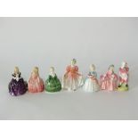 A collection of seven Royal Doulton figures comprising Rose HN1368, The Rag Doll HN2142, Belle