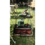 A vintage Atco petrol driven cylinder lawn mower with rear roller, 20 inch cut complete with