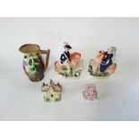 A pair of 19th century Staffordshire equestrian figures showing Queen Victoria and Prince Albert,