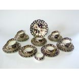 A collection of 19th century tea wares with painted and gilded Imari type decoration in the Royal