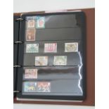 A Stanley Gibbons International Stamp Album containing a collection of British stamps dating from