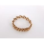 A 9ct gold articulated bracelet, 12.9g