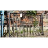 A pair of good quality heavy iron work driveway entrance gates with vertical rails, simple