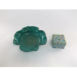 An oriental turquoise ground enamel bowl modelled as a water lily leaf and raised on three