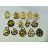 A collection of fourteen good cast horse brasses.